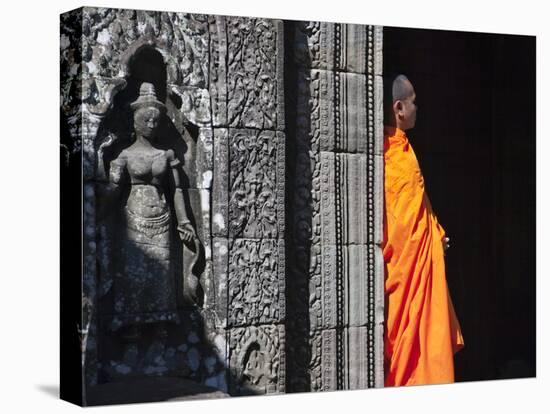 Monk with Buddhist Statues in Banteay Kdei, Cambodia-Keren Su-Stretched Canvas