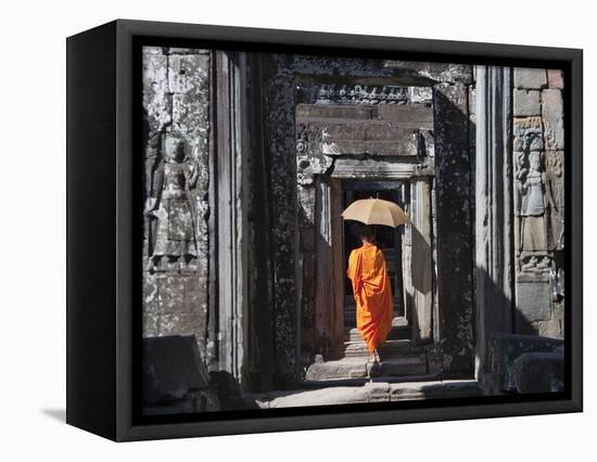 Monk with Buddhist Statues in Banteay Kdei, Cambodia-Keren Su-Framed Stretched Canvas