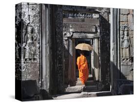 Monk with Buddhist Statues in Banteay Kdei, Cambodia-Keren Su-Stretched Canvas