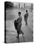 Monks Begging For Food at Dawn on Main Thoroughfare of Bangkok-Howard Sochurek-Stretched Canvas