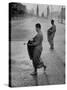 Monks Begging For Food at Dawn on Main Thoroughfare of Bangkok-Howard Sochurek-Stretched Canvas