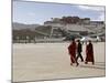 Monks Carrying Umbrellas to Shield Against the Sun, in Front of the Potala Palace, Tibet-Don Smith-Mounted Photographic Print