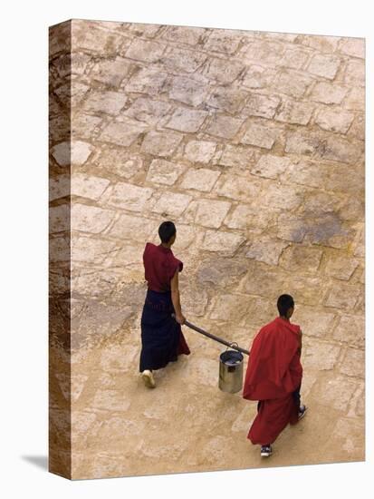 Monks Carrying Yak Butter, Ganden Monastery, Tagtse County, Tibet-Michele Falzone-Stretched Canvas