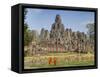 Monks Looking at Bayon Temple, Angkor, Siem Reap, Cambodia-null-Framed Stretched Canvas