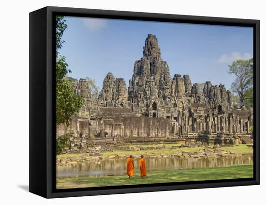 Monks Looking at Bayon Temple, Angkor, Siem Reap, Cambodia-null-Framed Stretched Canvas