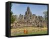 Monks Looking at Bayon Temple, Angkor, Siem Reap, Cambodia-null-Framed Stretched Canvas