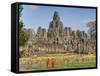 Monks Looking at Bayon Temple, Angkor, Siem Reap, Cambodia-null-Framed Stretched Canvas