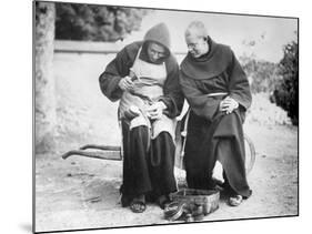 Monks Mending Sandals-null-Mounted Photographic Print