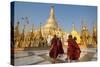 Monks walk around Shwedagon Pagoda, Yangon (Rangoon), Myanmar (Burma), Asia-Alex Treadway-Stretched Canvas