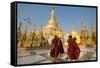 Monks walk around Shwedagon Pagoda, Yangon (Rangoon), Myanmar (Burma), Asia-Alex Treadway-Framed Stretched Canvas