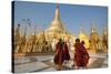 Monks walk around Shwedagon Pagoda, Yangon (Rangoon), Myanmar (Burma), Asia-Alex Treadway-Stretched Canvas