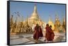 Monks walk around Shwedagon Pagoda, Yangon (Rangoon), Myanmar (Burma), Asia-Alex Treadway-Framed Stretched Canvas