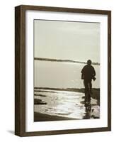 Monochromatic Image of a Cyclist on the Beach-null-Framed Photographic Print