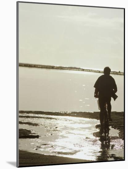 Monochromatic Image of a Cyclist on the Beach-null-Mounted Photographic Print