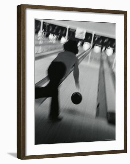 Monochromatic Image of a Woman Bowling-null-Framed Photographic Print