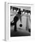 Monochromatic Image of a Woman Bowling-null-Framed Photographic Print