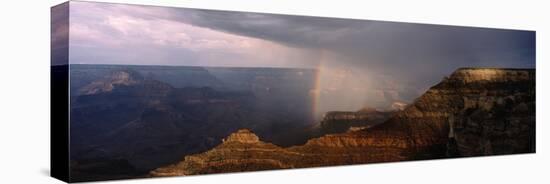 Monsoon Storm with Rainbow Passing Through the Grand Canyon-null-Stretched Canvas