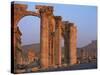 Monumental Arch at Archaeological Site, with Arab Castle Beyond, Palmyra, Syria-Bruno Morandi-Stretched Canvas