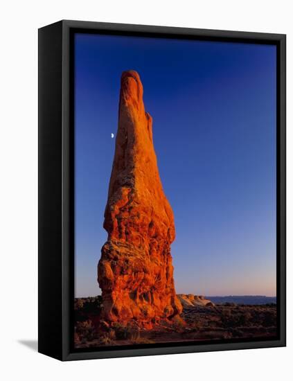 Moon and sandstone spire at Arches National Park-Scott T. Smith-Framed Stretched Canvas