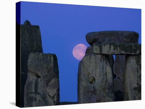 Moon Behind Stonehenge, UNESCO World Heritage Site, Wiltshire, England, United Kingdom, Europe-Charles Bowman-Stretched Canvas