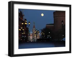 Moon is Seen over the Red Square in Moscow with the St. Basil Cathedral in the Background-null-Framed Photographic Print