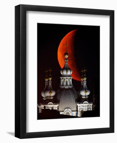 Moon is Seen Rising in the Sky Above the Domes of the Smolny Cathedral in St.Petersburg, Russia-null-Framed Premium Photographic Print