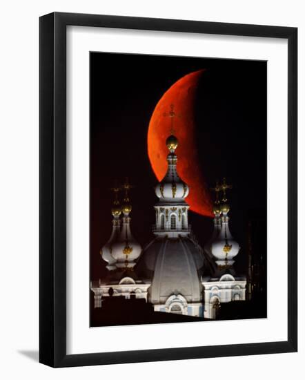 Moon is Seen Rising in the Sky Above the Domes of the Smolny Cathedral in St.Petersburg, Russia-null-Framed Photographic Print