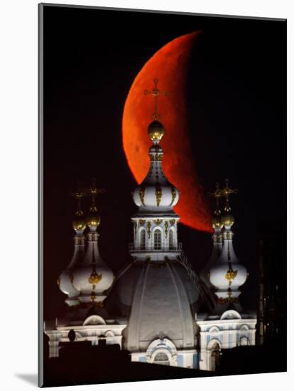 Moon is Seen Rising in the Sky Above the Domes of the Smolny Cathedral in St.Petersburg, Russia-null-Mounted Photographic Print