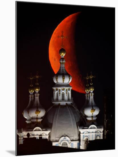Moon is Seen Rising in the Sky Above the Domes of the Smolny Cathedral in St.Petersburg, Russia-null-Mounted Photographic Print