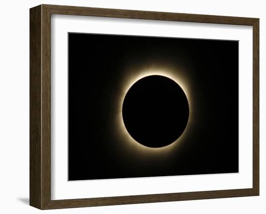 Moon Passes Between the Sun and the Earth During a Total Solar Eclipse in Varanasi, India-null-Framed Photographic Print