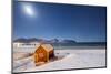 Moonlight on a Typical Fishermen Cabin Surrounded by Snow, Ramberg, Flakstad-Roberto Moiola-Mounted Photographic Print