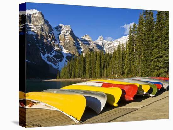 Moraine Lake and Rental Canoes Stacked, Banff National Park, Alberta, Canada-Larry Ditto-Stretched Canvas