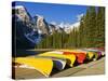 Moraine Lake and Rental Canoes Stacked, Banff National Park, Alberta, Canada-Larry Ditto-Stretched Canvas