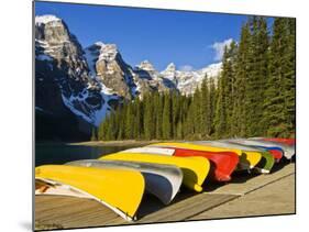 Moraine Lake and Rental Canoes Stacked, Banff National Park, Alberta, Canada-Larry Ditto-Mounted Photographic Print