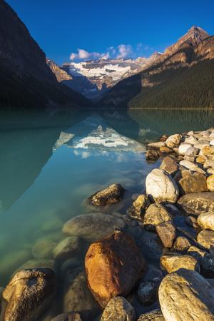 https://imgc.allpostersimages.com/img/posters/morning-light-on-lake-louise-banff-national-park-alberta-canada_u-L-Q1IKDM00.jpg?artPerspective=n