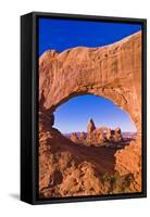 Morning light on Turret Arch through North Window, Arches National Park, Utah, USA-Russ Bishop-Framed Stretched Canvas