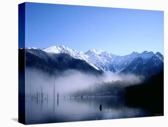 Morning Mist Covers Taisho-Ike Lake and Hodaka Mountain Range, Kamikochi, Nagano, Japan-null-Stretched Canvas