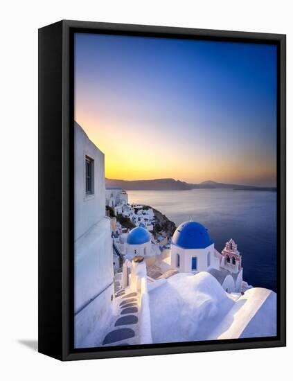 Morning sunlight on the blue houses of Oia, Santorini, Greece-Jan Christopher Becke-Framed Stretched Canvas