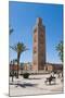 Moroccan Man Sat on a Bench in Front of Koutoubia Mosque, Marrakech, Morocco, North Africa, Africa-Matthew Williams-Ellis-Mounted Photographic Print