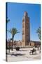 Moroccan Man Sat on a Bench in Front of Koutoubia Mosque, Marrakech, Morocco, North Africa, Africa-Matthew Williams-Ellis-Stretched Canvas