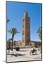 Moroccan Man Sat on a Bench in Front of Koutoubia Mosque, Marrakech, Morocco, North Africa, Africa-Matthew Williams-Ellis-Mounted Photographic Print