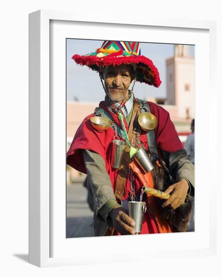 Moroccan Water Seller in Traditional Dress in the Djemaa El Fna, Marrakech-Julian Love-Framed Photographic Print