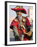 Moroccan Water Seller in Traditional Dress in the Djemaa El Fna, Marrakech-Julian Love-Framed Photographic Print