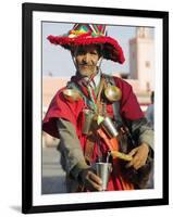 Moroccan Water Seller in Traditional Dress in the Djemaa El Fna, Marrakech-Julian Love-Framed Photographic Print