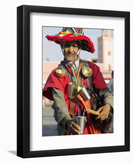 Moroccan Water Seller in Traditional Dress in the Djemaa El Fna, Marrakech-Julian Love-Framed Photographic Print