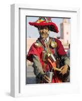 Moroccan Water Seller in Traditional Dress in the Djemaa El Fna, Marrakech-Julian Love-Framed Photographic Print