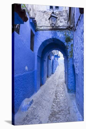 Morocco. A blue alley in the hill town of Chefchaouen.-Brenda Tharp-Stretched Canvas