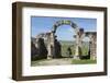 Morocco. A man on a donkey passes under stone columns and arches at the roman ruins of Volubilis.-Brenda Tharp-Framed Photographic Print