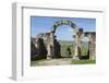 Morocco. A man on a donkey passes under stone columns and arches at the roman ruins of Volubilis.-Brenda Tharp-Framed Photographic Print