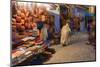 Morocco. An elderly man walks past tourist shops along a street in the blue city of Chefchaouen.-Brenda Tharp-Mounted Photographic Print